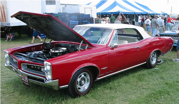 Here's my dad's 1966 Pontiac GTO Convertible that we restored in 1990